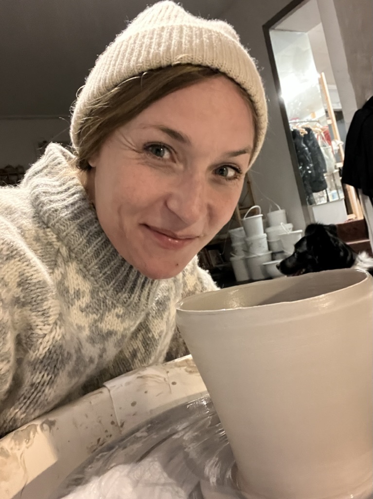 Mia Wagner in the studio with a ceramic piece
