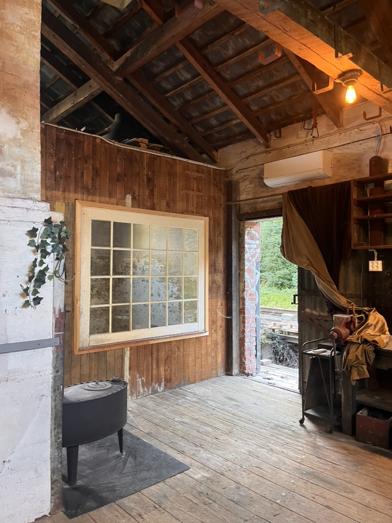 Workshop interior with aged window and warm light